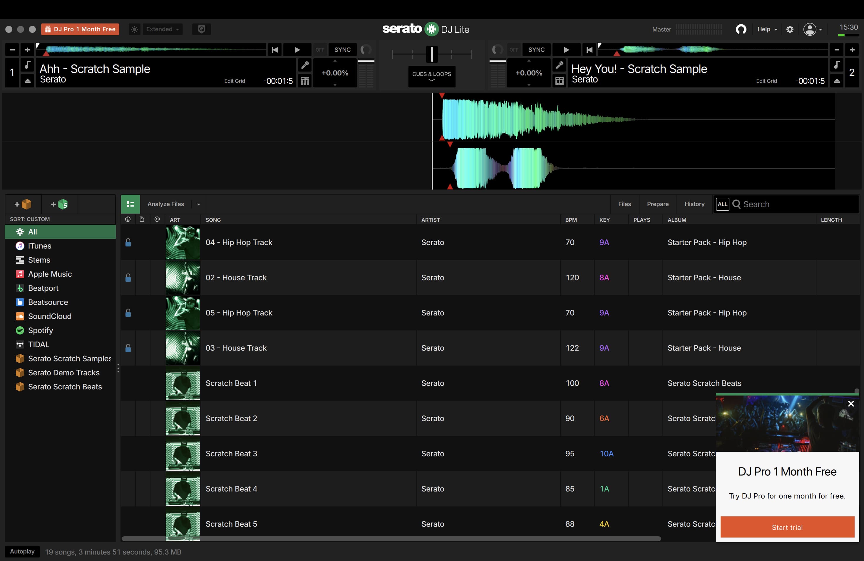 Serato DJ Lite with two decks, stacked waveforms, streaming services, crates, and a track library